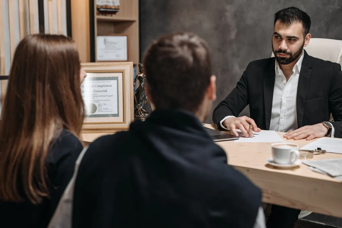 Attorney meeting with clients during an immigration intake consultation